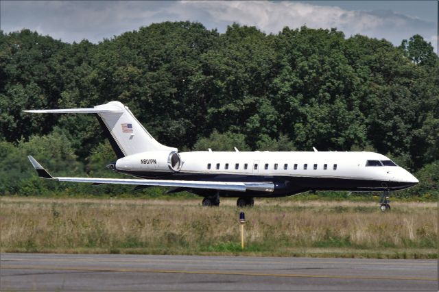 Bombardier Global Express (N801PN) - Brewing storm above the trees.