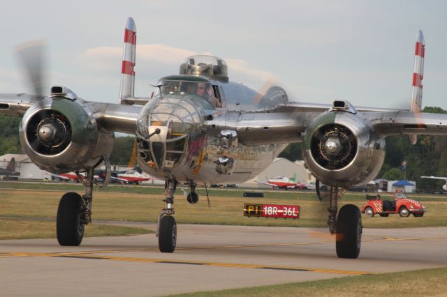 North American TB-25 Mitchell (N9079Z) - Panchito taxiing to Warbirds North 40 Oshkosh '23 past one of those iconic EAA VW Bugs. 