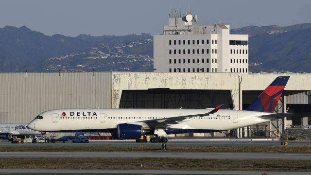 Airbus A350-900 (N505DN) - Getting towed to parking on taxiway Charlie at LAX