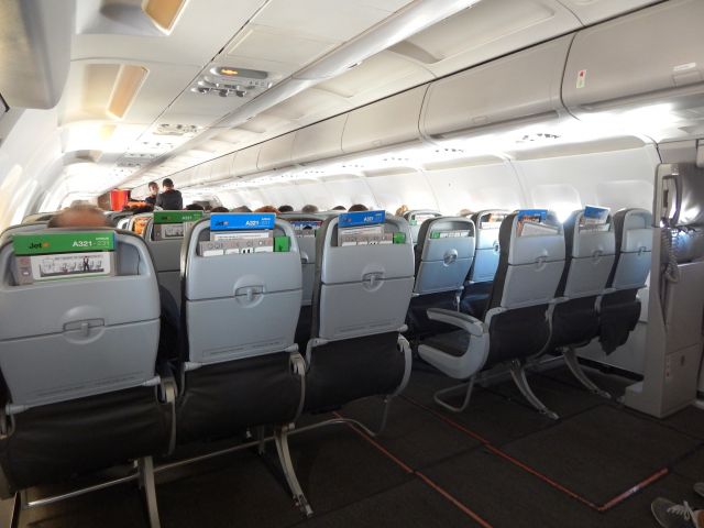 Airbus A321 (VH-VWZ) - In flight MEL - SYD 13 January 2014. Got to love the room in the exit row.