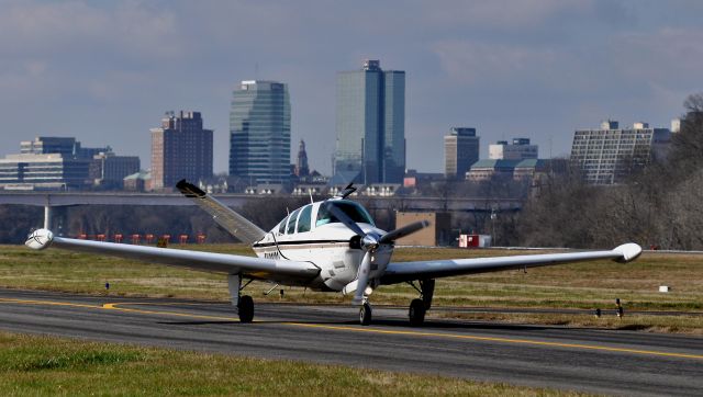 Beechcraft 35 Bonanza (N309DC) - At KDKX, Knoxville, TN, in the background.