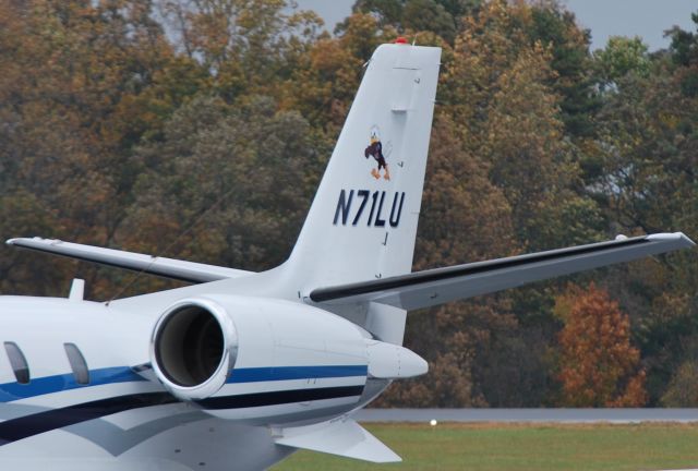 Cessna Citation Excel/XLS (FAW71) - FALWELL AVIATION (Liberty University) at KJQF with mascot logo of "Sparky the Eagle" on the tail - 11/6/14 