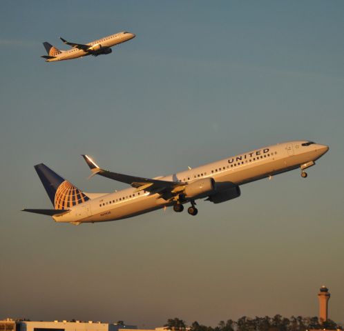 Boeing 737-900 (N69838) - The E175 in the background is tail #N89308