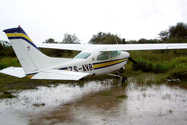 Cessna Centurion (ZS-AVB) - At Impalila Island (Namibia)  after heavy rain.