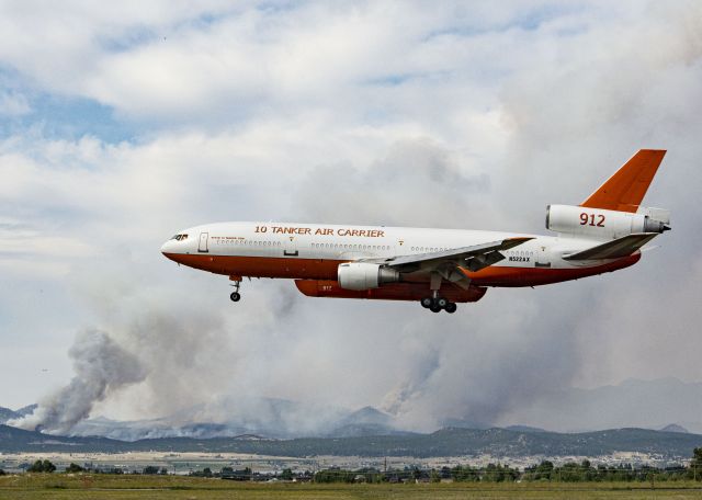 McDonnell Douglas DC-10 (N522AX) - Fighting a forest fire near Helena, MT.  Fire is in the background.