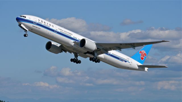 BOEING 777-300 (B-2007) - CSN2007 climbs from Rwy 34L to begin its delivery flight to ZBTJ / TSN on 8/6/14. (LN:1223 / cn 43221).