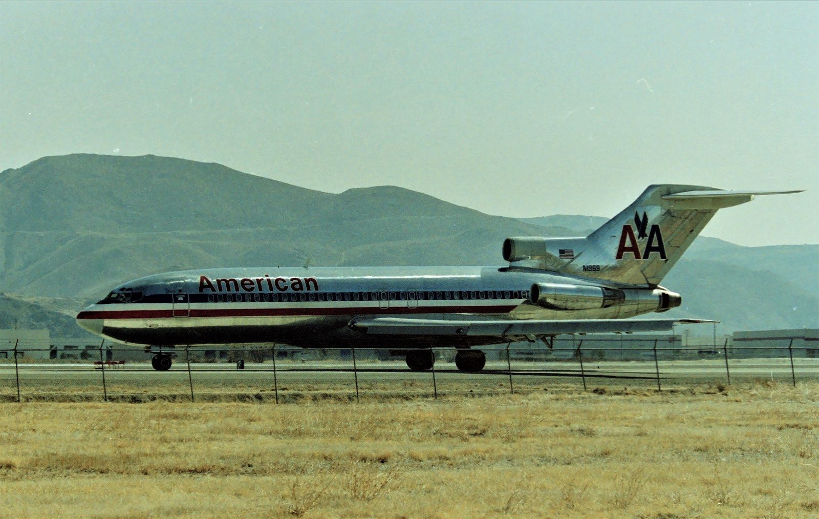 Boeing 727-100 (N1969) - KRNO - While out filming the NANG "High Rollers" F-4 Phantoms at Reno, the Boeing 727 landed and taxi'd right by the Air Park that used to be at the south end of Reno Airport, west side. CN 20044 LN: 592 delvd new to American Airlines 6/24/1969. Shown here apprx June 1990. 