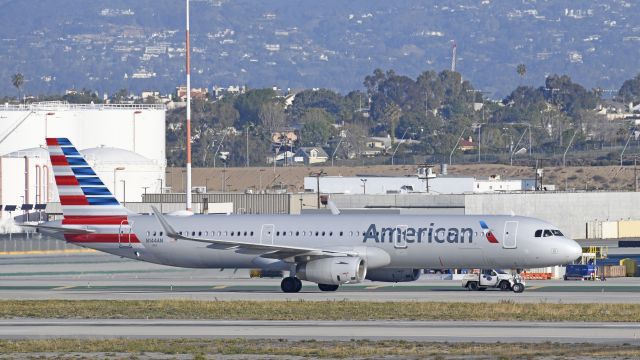 Airbus A321 (N144AN) - Taxiing to gate on taxiway Bravo at LAX