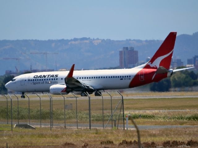 Boeing 737-800 (VH-VXM) - Turning on to taxi-way and heading to Terminal 1, after arrival on runway 23. Wednesday 4th January 2012.