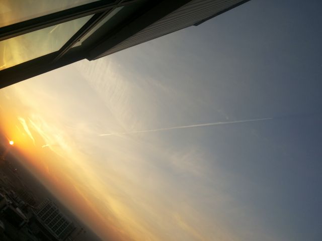 — — - Journey in the shadow, taken fram IKIA tower,sunrise time, the flight at 38000 feet is flying in its shadow