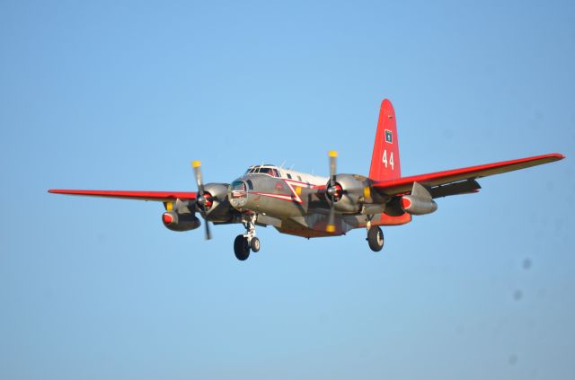 N1386C — - Neptune Aviation's Tanker 44 returns to Missoula from fighting a fire, at sunset.