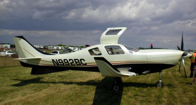 Lancair Lancair 4 (N992BC) - N992BC, from Texarkana, Texas, was displayed at Oshkosh for AirVenture 2009.  This is the planes current paint job as of July 2009.  Notice the twin dosal fins on the bottom of the fuselage.  Lancair IV-P Turbine.