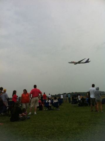 BOEING 777-200LR — - FedEx B77L flyby during the Memphis Air show in Millington TN  sorry that the pic isnt better.  This is the high speed pass and it was raining