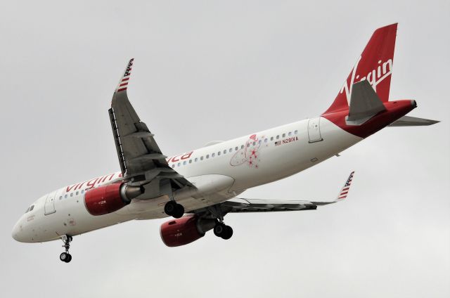 Airbus A320 (N281VA) - "Pineapple Express" Surfer girl logo on aft fuselage. Shown arriving 23-R on 03-08-18