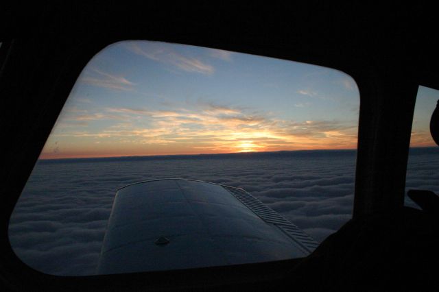 Piper Cherokee (N6671W) - On top at sunset.