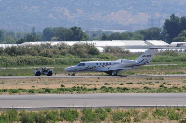 Cessna Citation CJ4 (N1440W) - Citation on the hook back to Duncan from Runway 36 after engine test runs. br /Best viewed in full! 