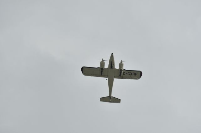 Piper Aztec (C-GXRP) - Just crossing overhead the airport, joining the circuit.