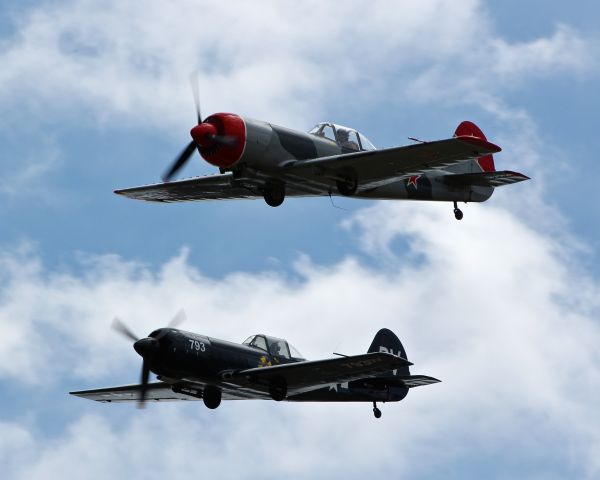 YAKOVLEV Yak-50 (N613BM) - Two Yak 50s doing a low fly-by at the San Martin Airport.