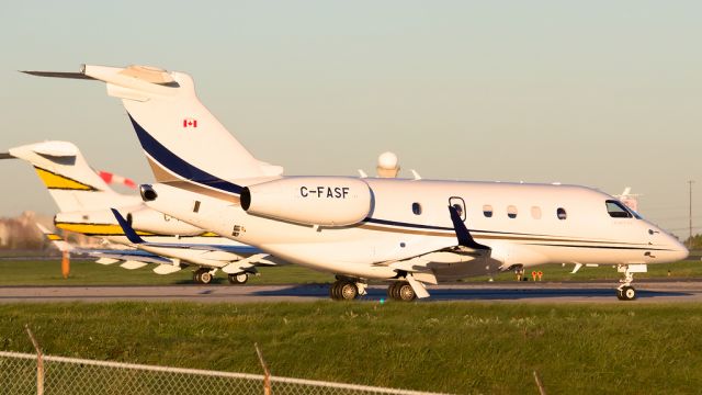 Embraer Legacy 450 (C-FASF) - Legacy 450 waiting at the hold short line (C-FMIX CL35 in the next lane)