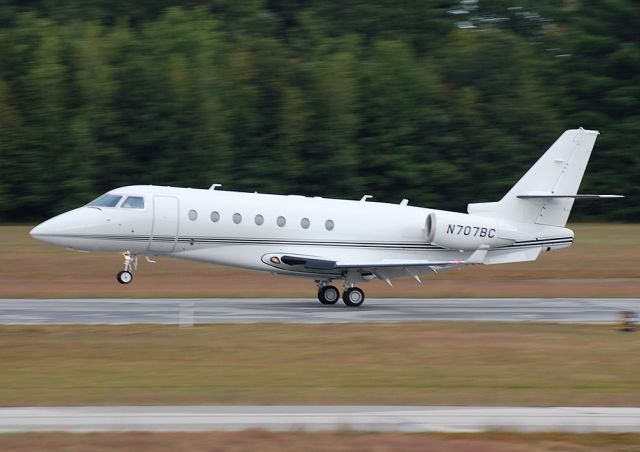 IAI Gulfstream G200 (N707BC) - 707BC departing for IAD, as the sun sets and the rain starts...