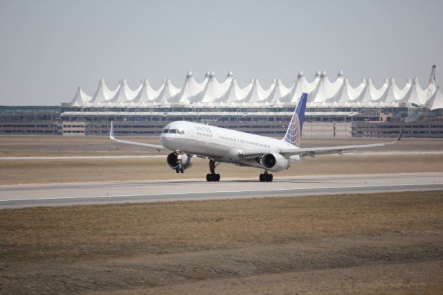 BOEING 757-300 (N57870) - Taking off to the west on runway 25.