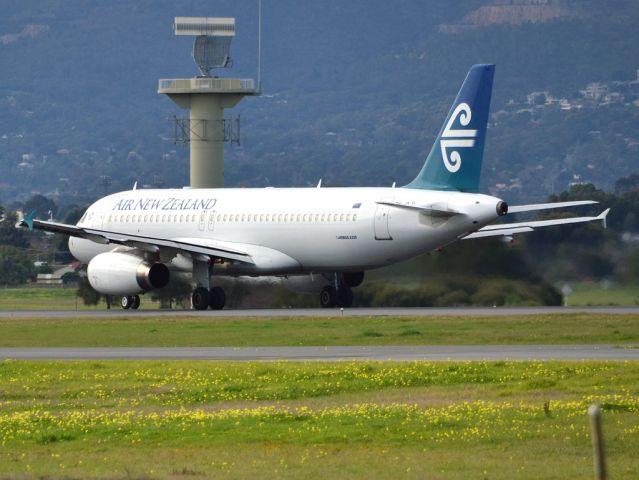 Airbus A320 (ZK-OJI) - Rolling for take off on runway 05, for flight home to Auckland, New Zealand. Thursday 12th July 2012.