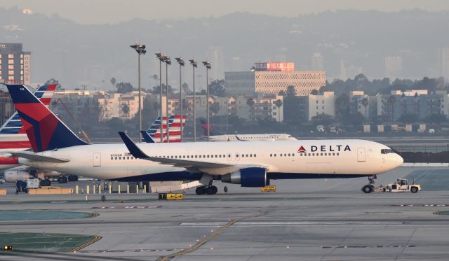 BOEING 767-300 (N178DN) - Getting an early morning tow to gate at LAX.