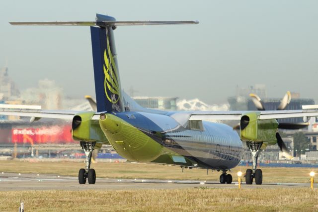 SKYWORK — - Lining up at London City Airport. Note the deployed spoilers on the wing.