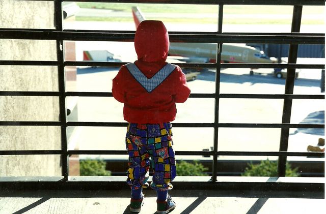 Boeing 737-700 (N344SW) - Start them young. My son at 2 yrs old. Shot in 1994, Terminal A, Parking Garage Roof top