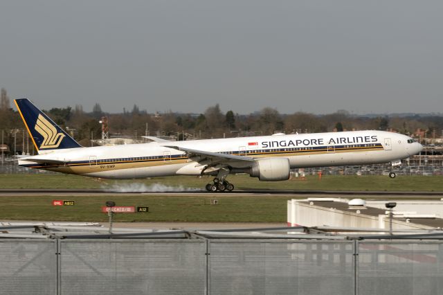 BOEING 777-300ER (9V-SWP) - 7th March, 2025:  Flight SQ 308 from Changi Airport makes a smokey touch down on runway 09L at Heathrow.