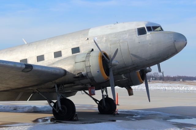 Douglas DC-3 (N33632) - Keeping the oil off the tarmac.