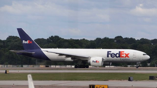 BOEING 777-200LR (N851FD) - "Tristin" on takeoff roll down 18C.