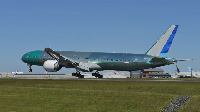 BOEING 777-300 (PK-GIA) - BOE141 nears touchdown on runway 34L to complete its maiden flight on 5/1/13. (LN:1104 cn 40074).