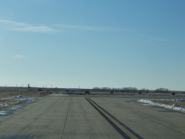 — — - Holding short of runway 34/16 Hays