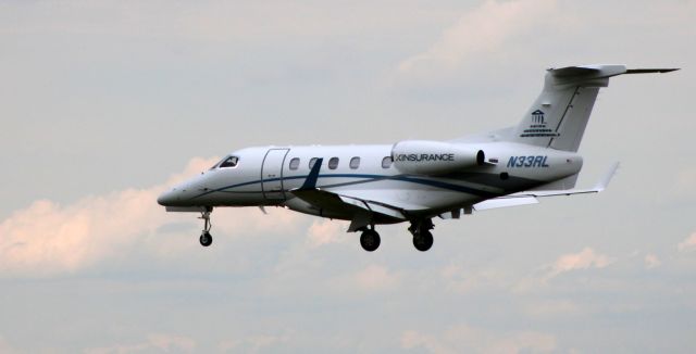 Embraer Phenom 300 (N33RL) - On final is this 2017 Embraer Phenom 300 in the Summer of 2020.