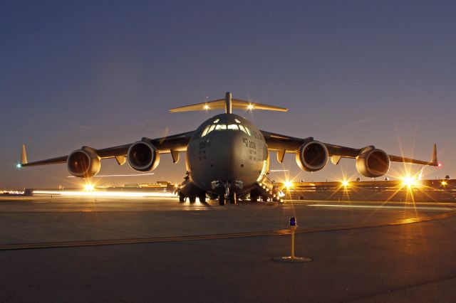 Boeing Globemaster III (96-0006) - Crews work to load the presidential motorcade vehicles on a USAF C-17, 96-0006 c/n P38 on 13 Nov 2013.