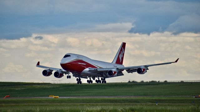 Boeing 747-400 (N744ST) - Global SuperTanker (N744ST) Boeing 747-446 (BCF) landing on RWY 35L at Colorado Springs Airport after a return flight from Marana, Arizona