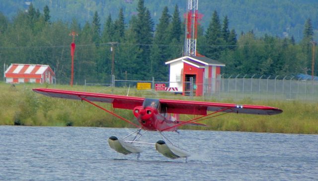 — — - Look closely at the float on the right and you will notice the keel just entering the pond.