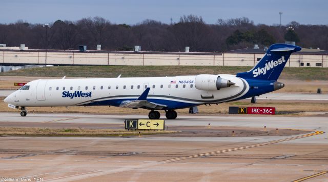 Canadair Regional Jet CRJ-700 (N604SX) - Took me by surprise while standing on the lower garage.