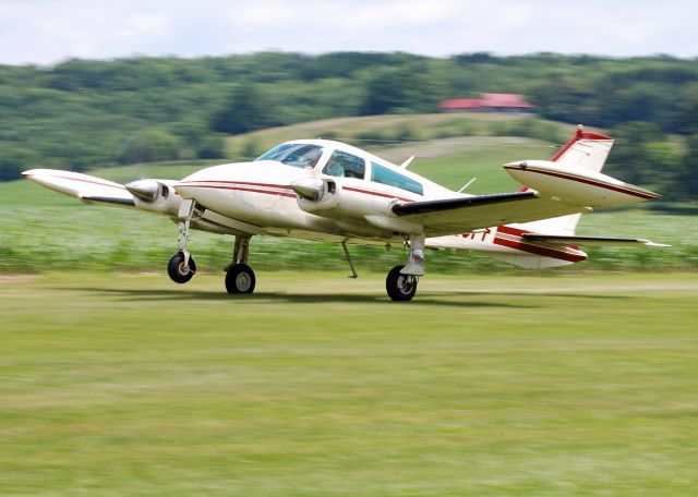 Cessna 310 (N23PF) - Panning shot at 1/80 sec shutter speed.