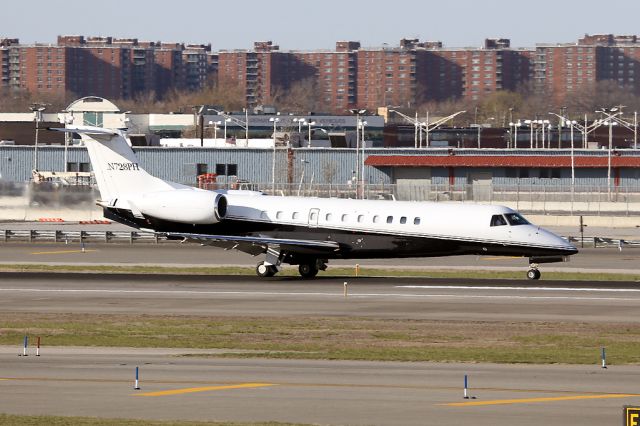 Embraer ERJ-135 (N728PH) - Landing 13R, seen from the JetBlue terminal