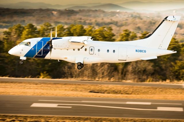 Fairchild Dornier 328 (N38CG) - 18.Feb.2010 - Arriving on 24 with the warm late afternoon light.