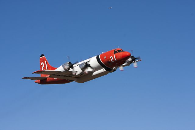 — — - Aero Union P3 Orion firefighting aircraft on low pass out of Ramona, California.