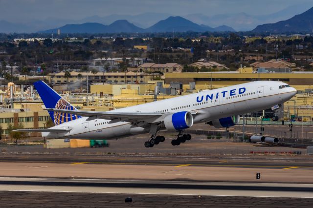 Boeing 777-200 (N768UA) - A United Airlines 777-200 taking off from PHX on 2/13/23, the busiest day in PHX history, during the Super Bowl rush. Taken with a Canon R7 and Canon EF 100-400 II L lens.