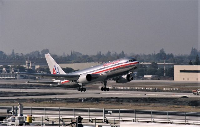 BOEING 767-200 (N3XXAA) - KSJC - Early/mid 2000s this surprise American Airlines 767-200 snuck into San Jose and luck I was here. American 767-200s did not serve San Jose very long, I only have 2-3 other photos of them here.This 767-200 shown departing Runway 30R while 30L was being redone. I have the reg on this jet, I'll have to find it later and update. In fact i may even have this jet on taxi here same day - I'll have to search my nearly 2000 photos here to find it quicker.