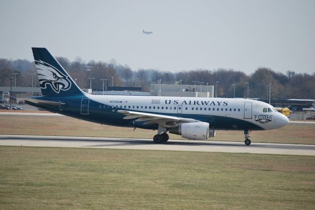 Airbus A319 (N709UW) - Taking off on runway 18C - 3/11/09