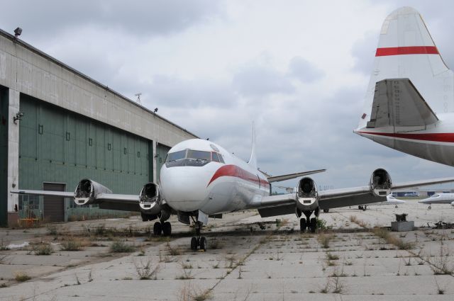 Lockheed L-188 Electra — - Love those old hanger doors.