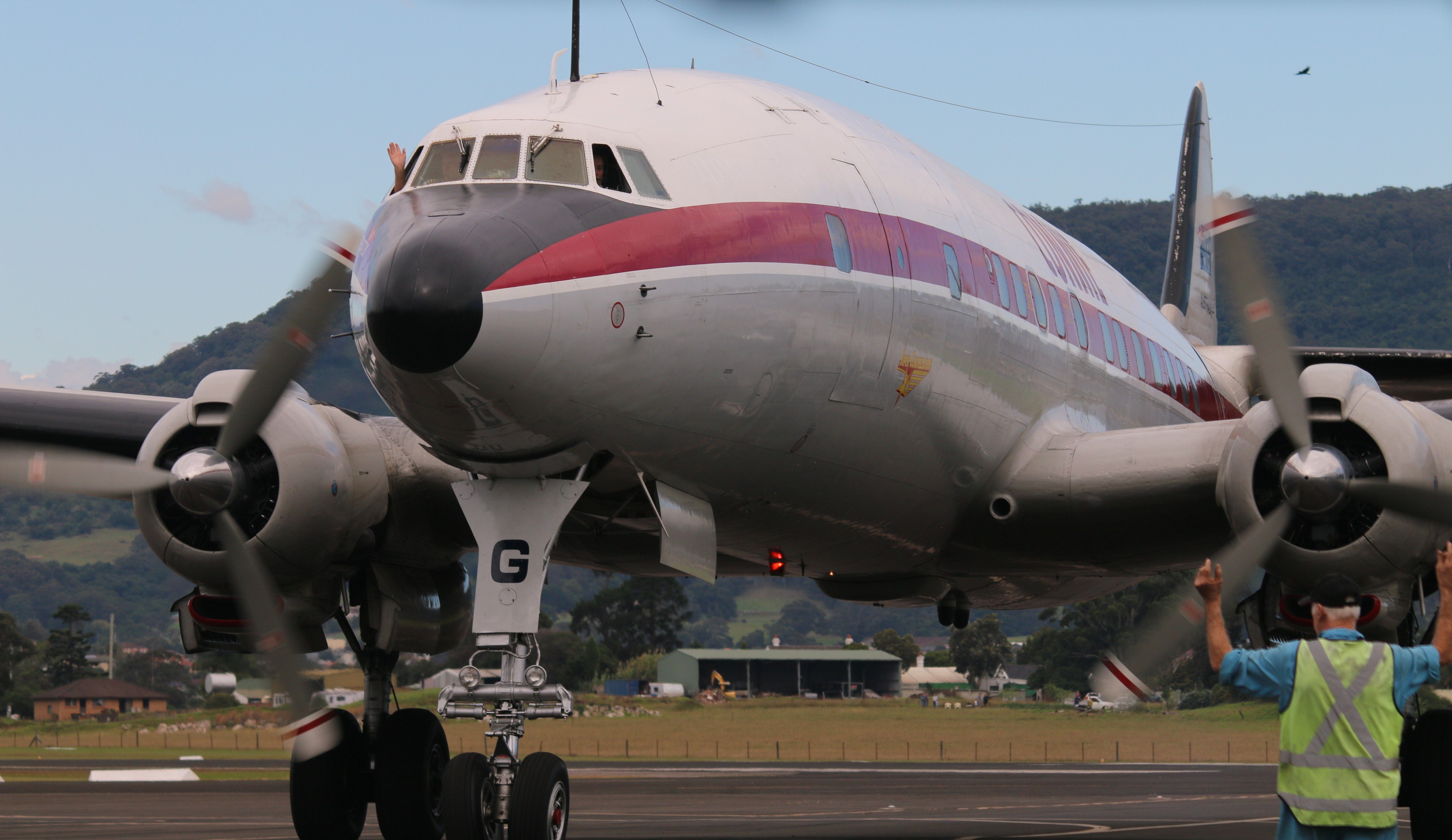 VH-AEG — - A wave from the flight deck of Connie at Wings over Illawarra Airshow