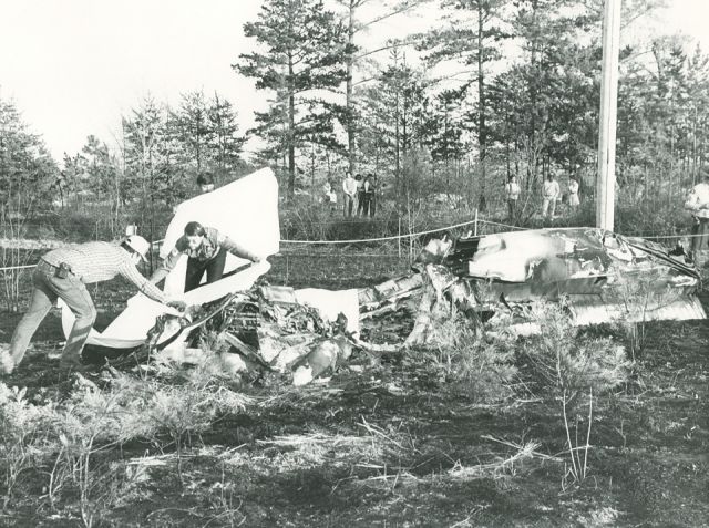 N18879 — - Rescuers cover remains after this Beech C23 crashed in a field in Semora N.C. 3-20-87 shortly after takeoff from Danville Regional Airport in Danville Va.  3 Fatal...NTSB-ATL87FA088.