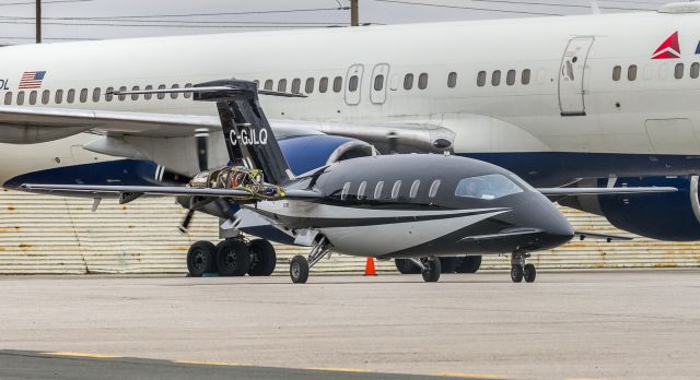 Learjet 35 (C-GJLQ) - Clearly not a Learjet 35 as Flightaware would have us believe, this Piaggio Avanti sans engine covers does run-ups and maintenance beside a Delta 757 which brought the Philadelphia 76er's to town